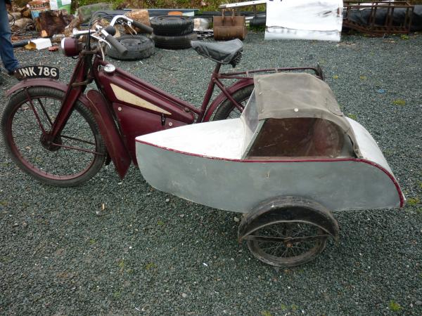 A delightful picture of a child's sidecar on a 1950's New Hudson Autocycle. The owner wonders if there is any other New Hudson Autocycle with a side car.